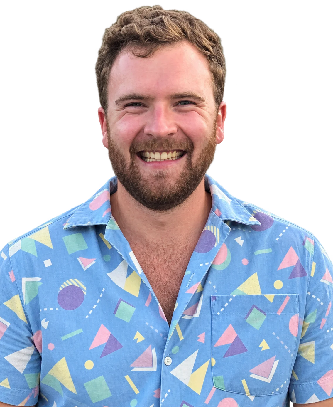 Nick smiling in his colourful blue shirt